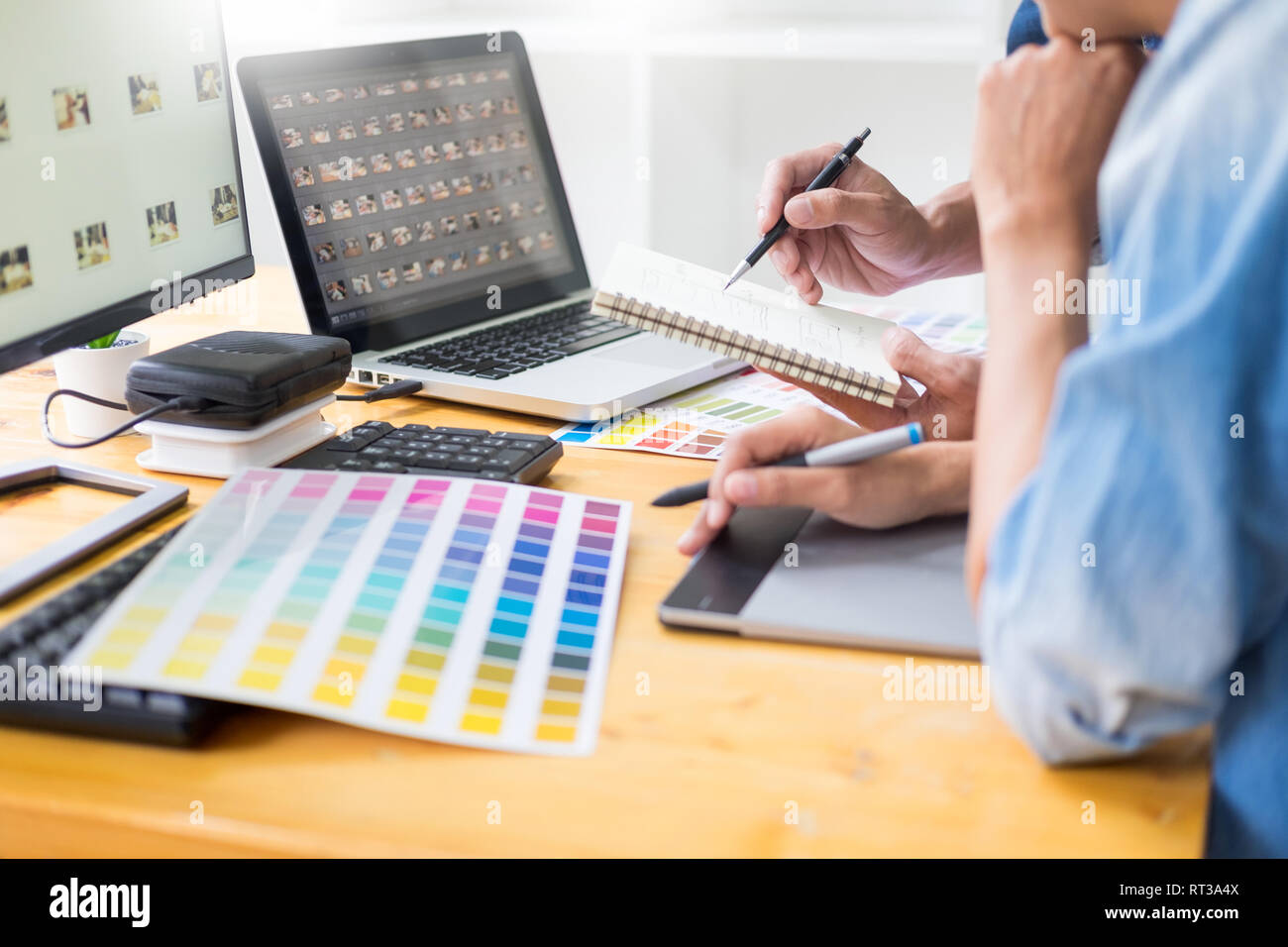 Graphic Designer Team Working On Web Design Using Color Swatches