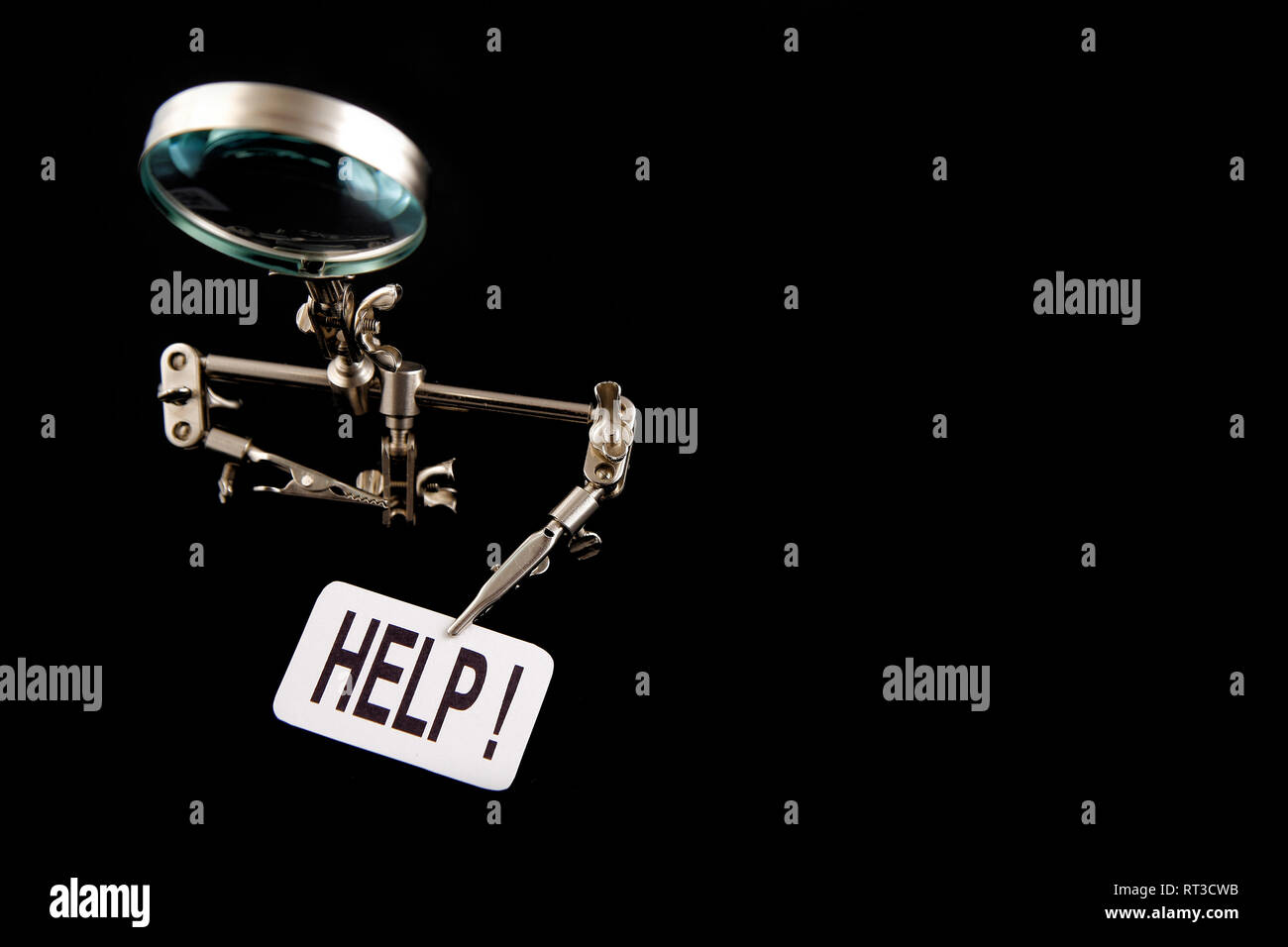 figure of steel man with "help" inscription on black background Stock Photo Alamy