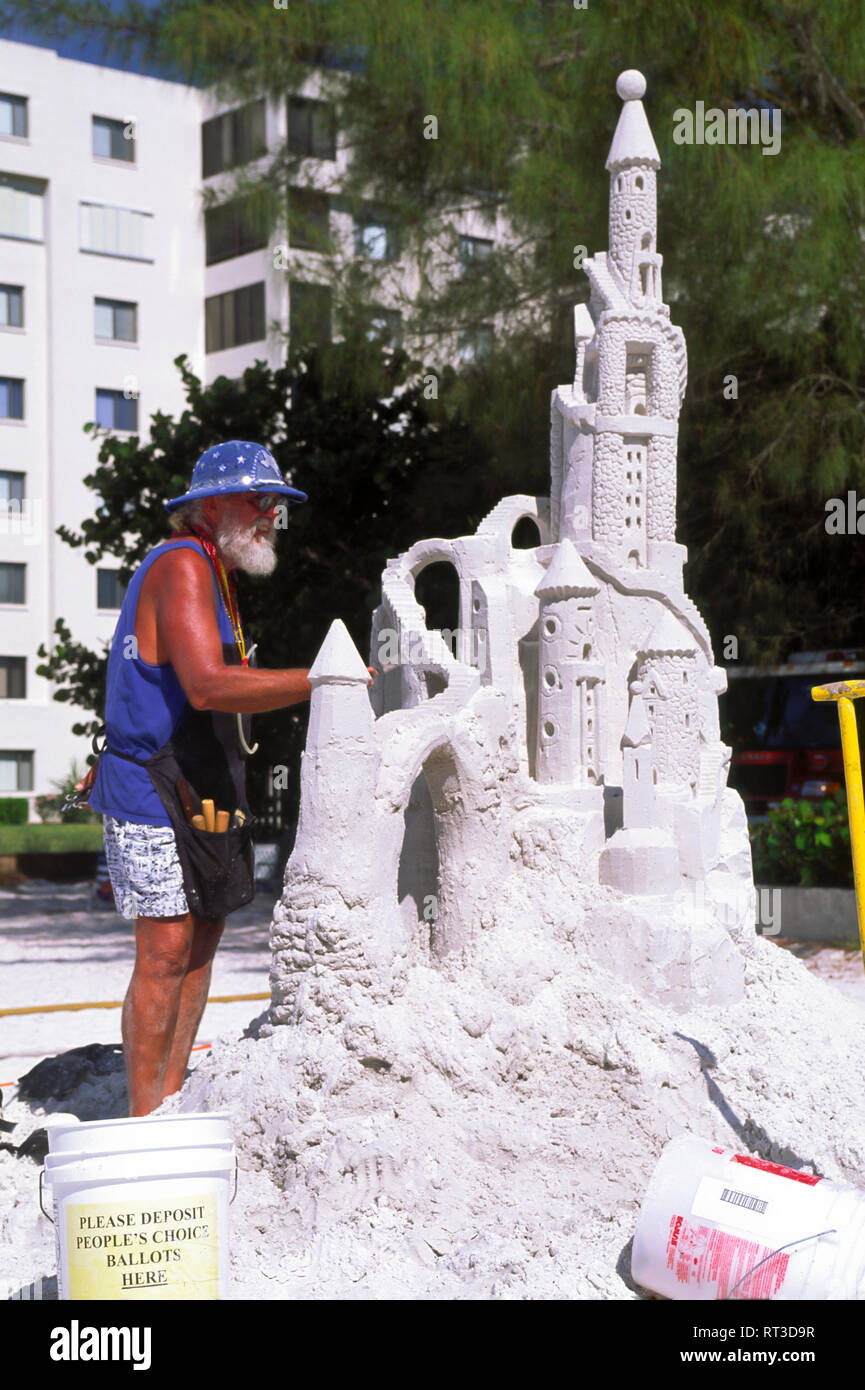 master sand sculptor; working; beach; building sand castle; large, contest; creative; art; Ft. Myers Beach; FL; Florida; vertical Stock Photo