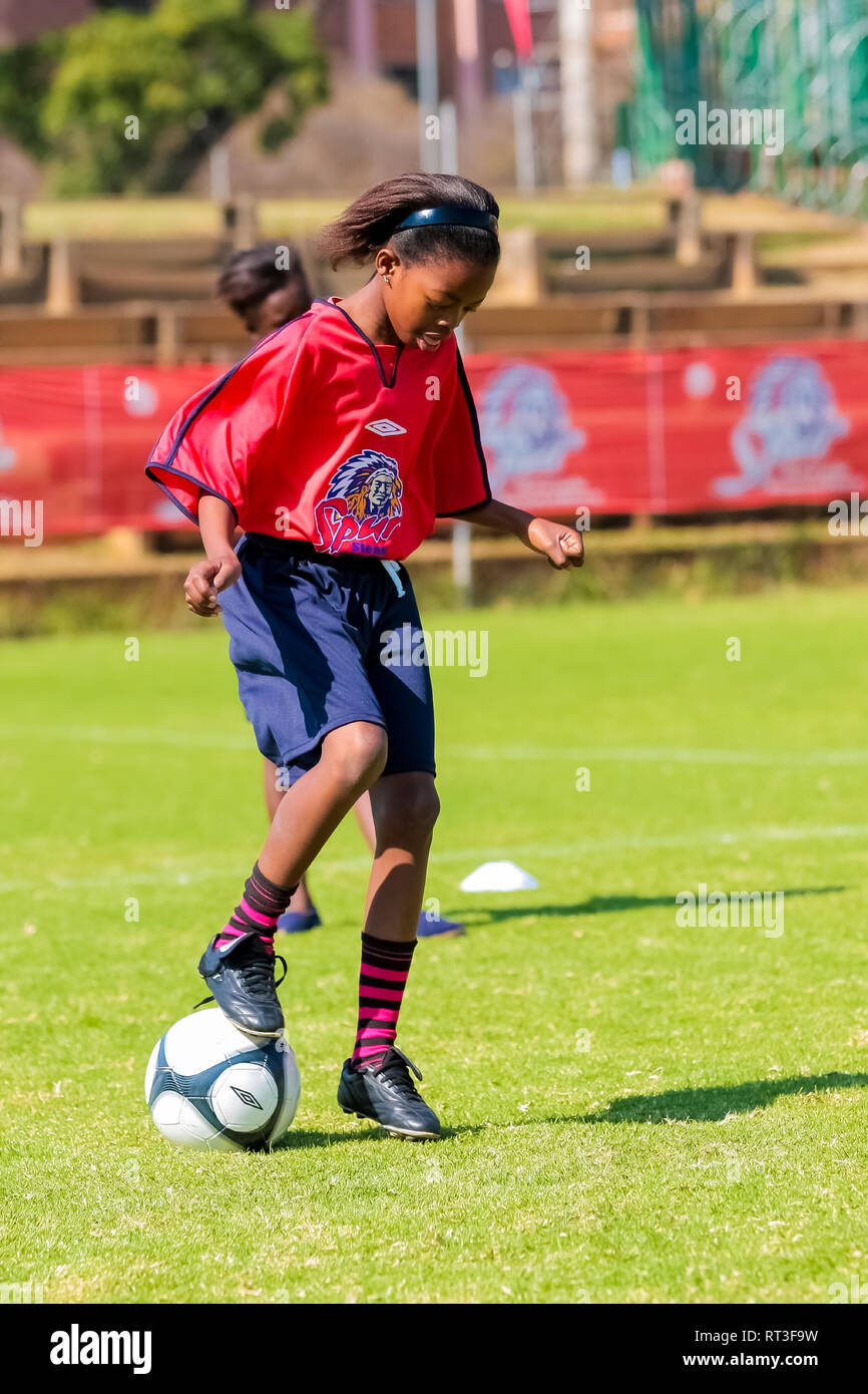 Johannesburg, South Africa June 29 2009 Diverse children playing soccer football at school