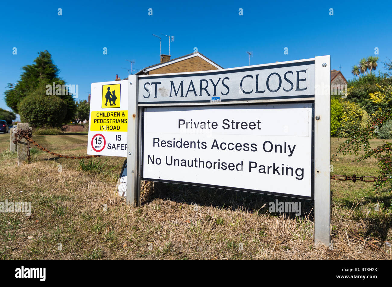 British road name sign fixed in the ground for a close, for a private road with residents access only and no unauthorised parking, in England, UK. Stock Photo