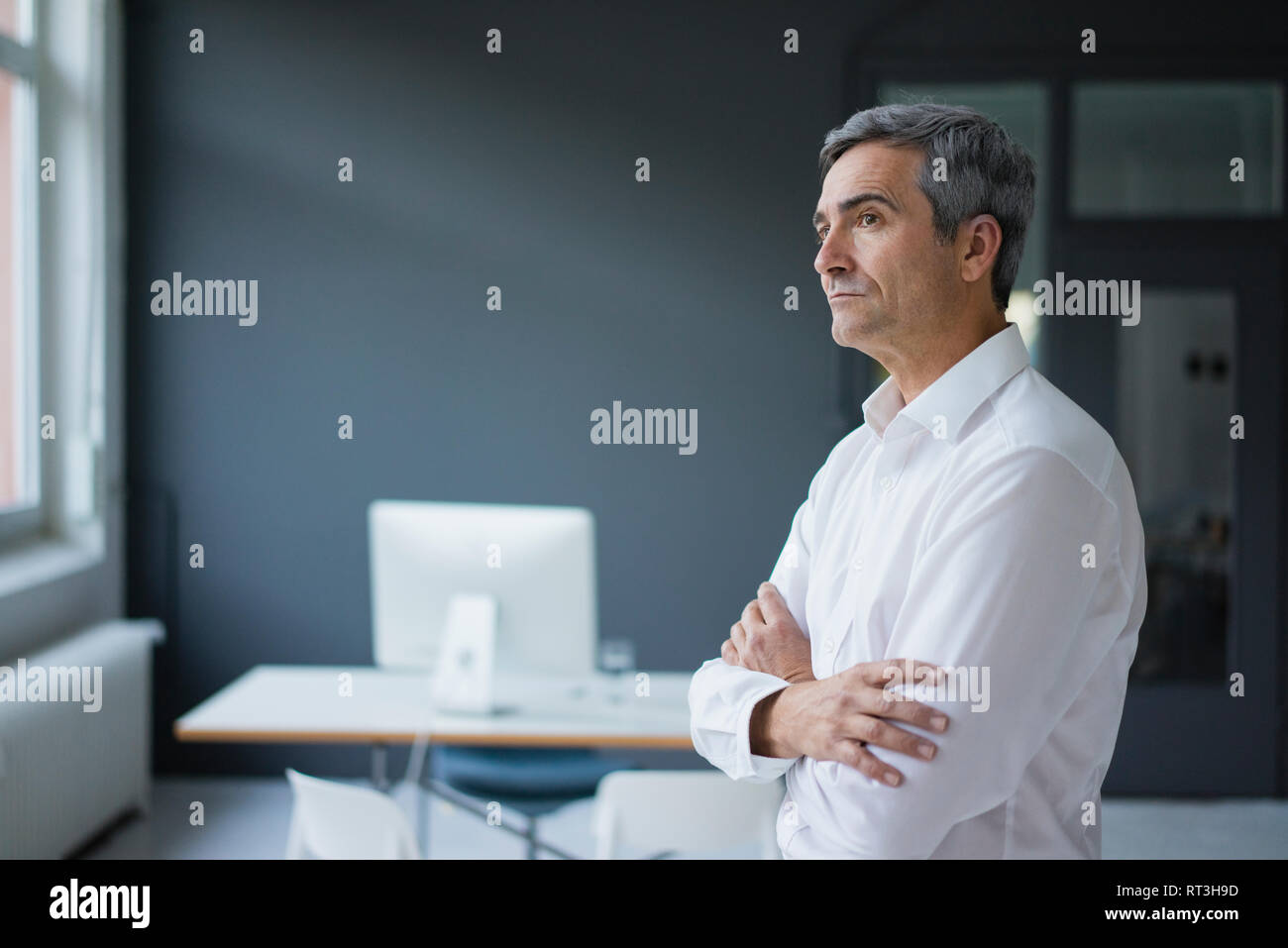 Businessman in the office thinking Stock Photo