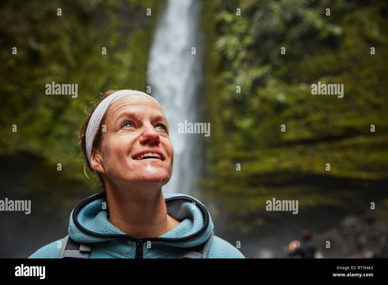 Chile, Patagonia, Osorno Volcano, portrait of woman admiring Las Cascadas waterfall Stock Photo