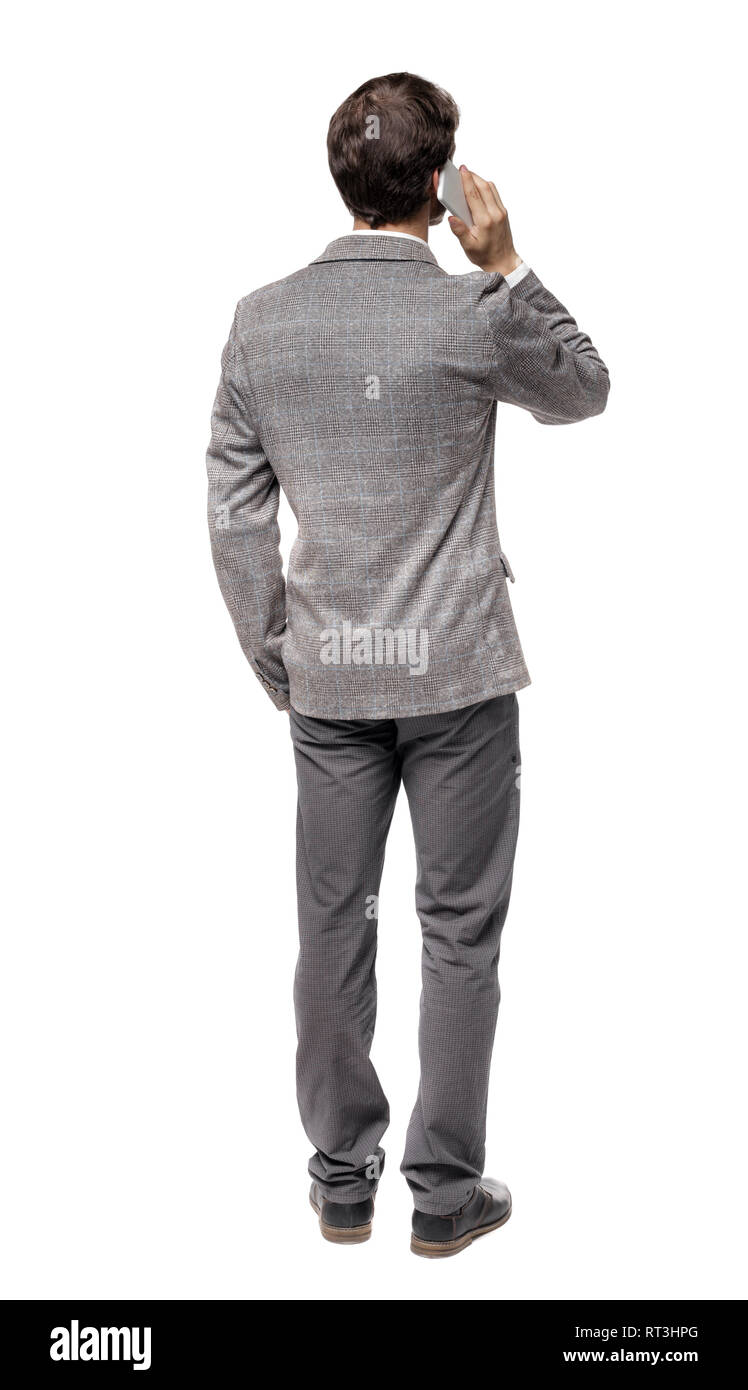 back view of business man in suit talking on mobile phone. rear view ...
