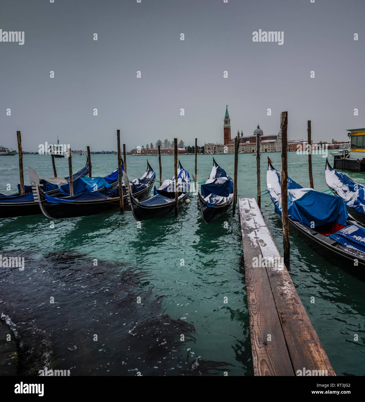 Winter in Venice, snow on gondolas, Grand Canal. Stock Photo