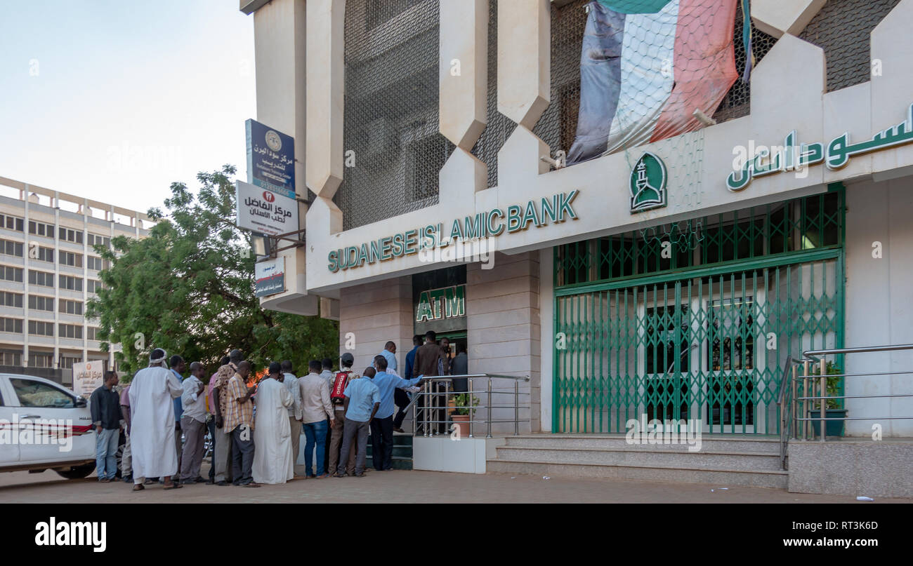 Khartoum, Sudan, February 5, 2019: People queuing at the ATM disbursement counter of the Sudan Islamic Bank to withdraw money. Stock Photo