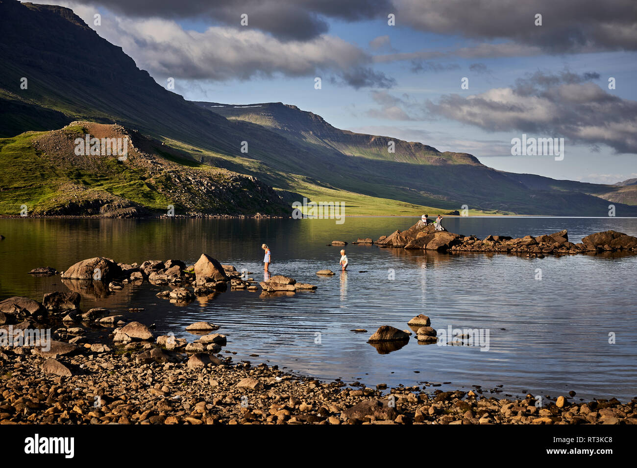 Kids playing in the water, Hitardalur, Western Iceland Stock Photo