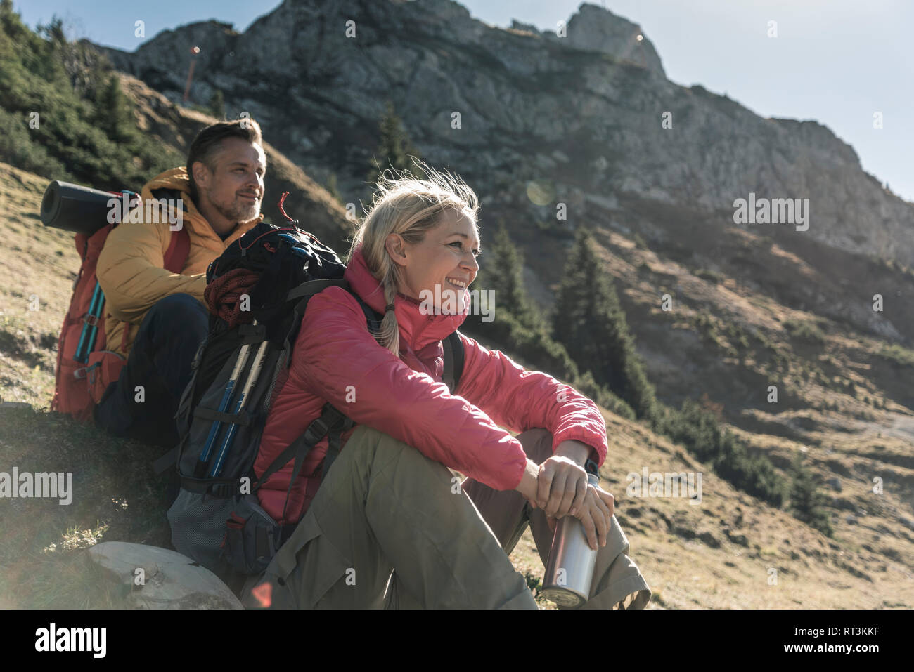 Austria, Tyrol, couple having a break during a hiking trip in the mountains Stock Photo