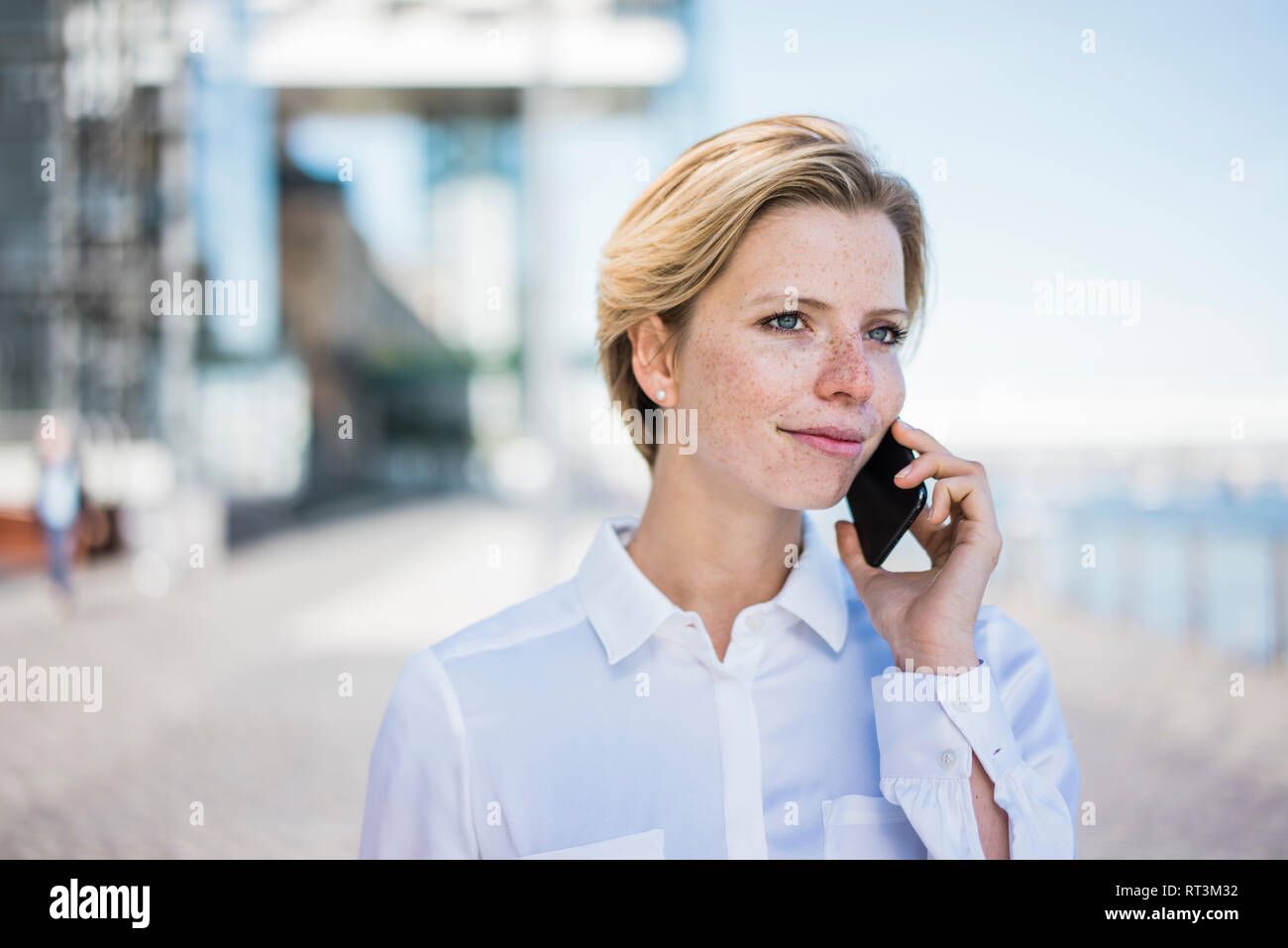 Young businesswoman using mobile phone Stock Photo