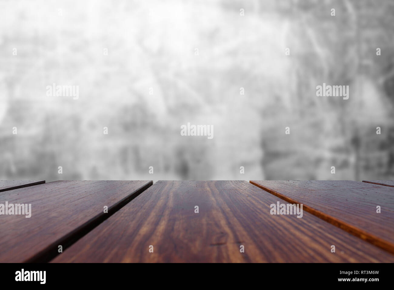Wood Table Top and concrete wall Background. Stock Photo
