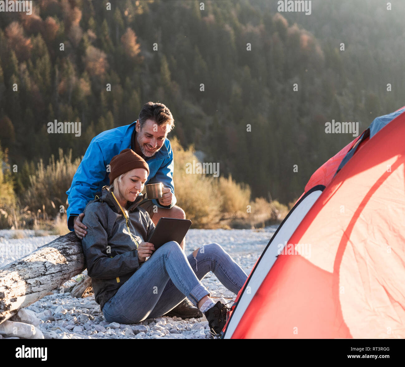 Mature couple camping riverside hi-res stock photography and images - Alamy