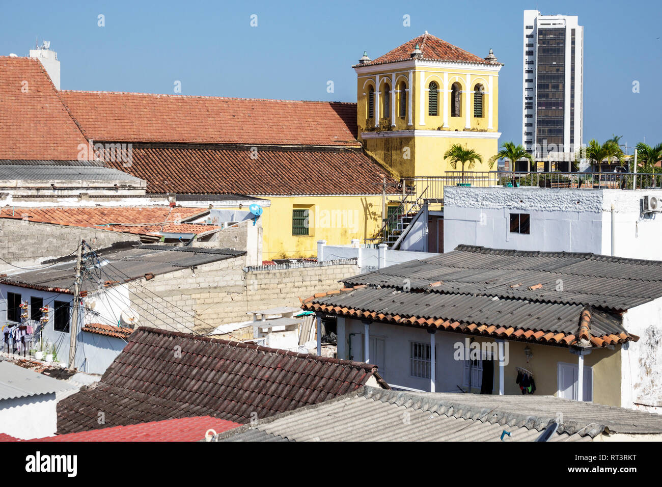 Cartagena Colombia,Center,centre,Getsemani,neighborhood,rooftops roofs,corrugated tin,tiles,Iglesia de la Santisima Trinidad Holy Trinity Church,bell Stock Photo