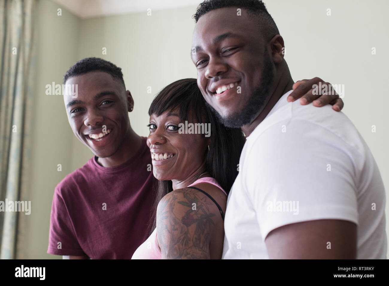 Portrait happy mother and teenage sons Stock Photo