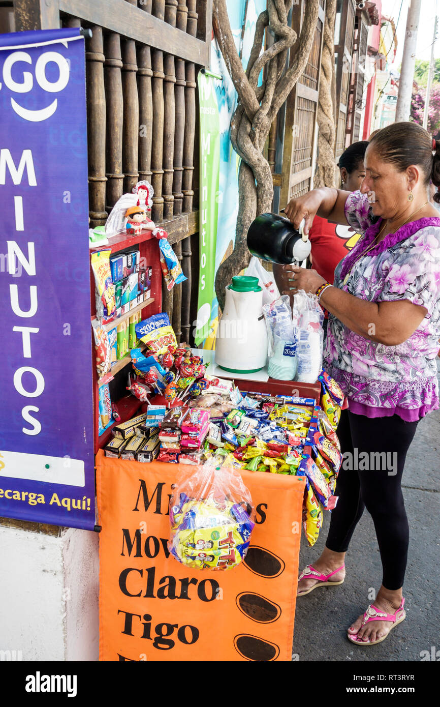 Cartagena Colombia,Center,centre,Getsemani,neighborhood,Hispanic resident residents,sidewalk street vendor,display selling,woman female women,candy sn Stock Photo