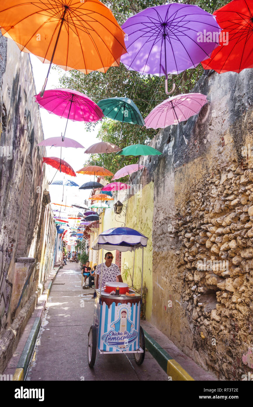Cartagena Colombia,Center,centre,Getsemani,Callejon Angosto Calle 27 hanging colorful umbrellas,installation,Hispanic resident residents,narrow reside Stock Photo
