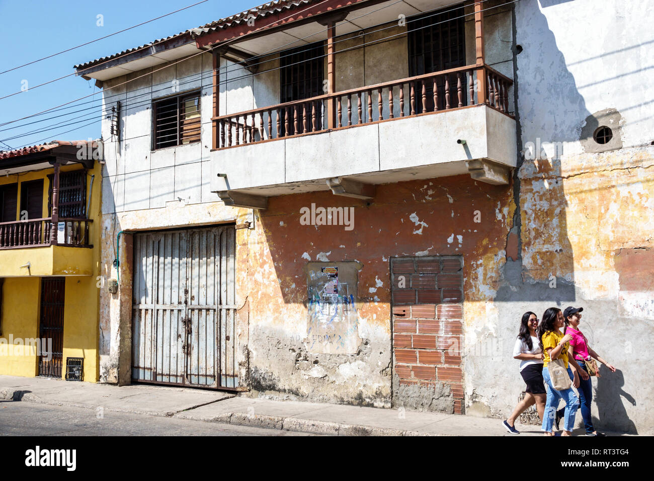 Cartagena Colombia,Center,centre,Getsemani,traditional working class neighborhood,balcony,peeling paint,teen teens teenage teenager teenagers youth ad Stock Photo