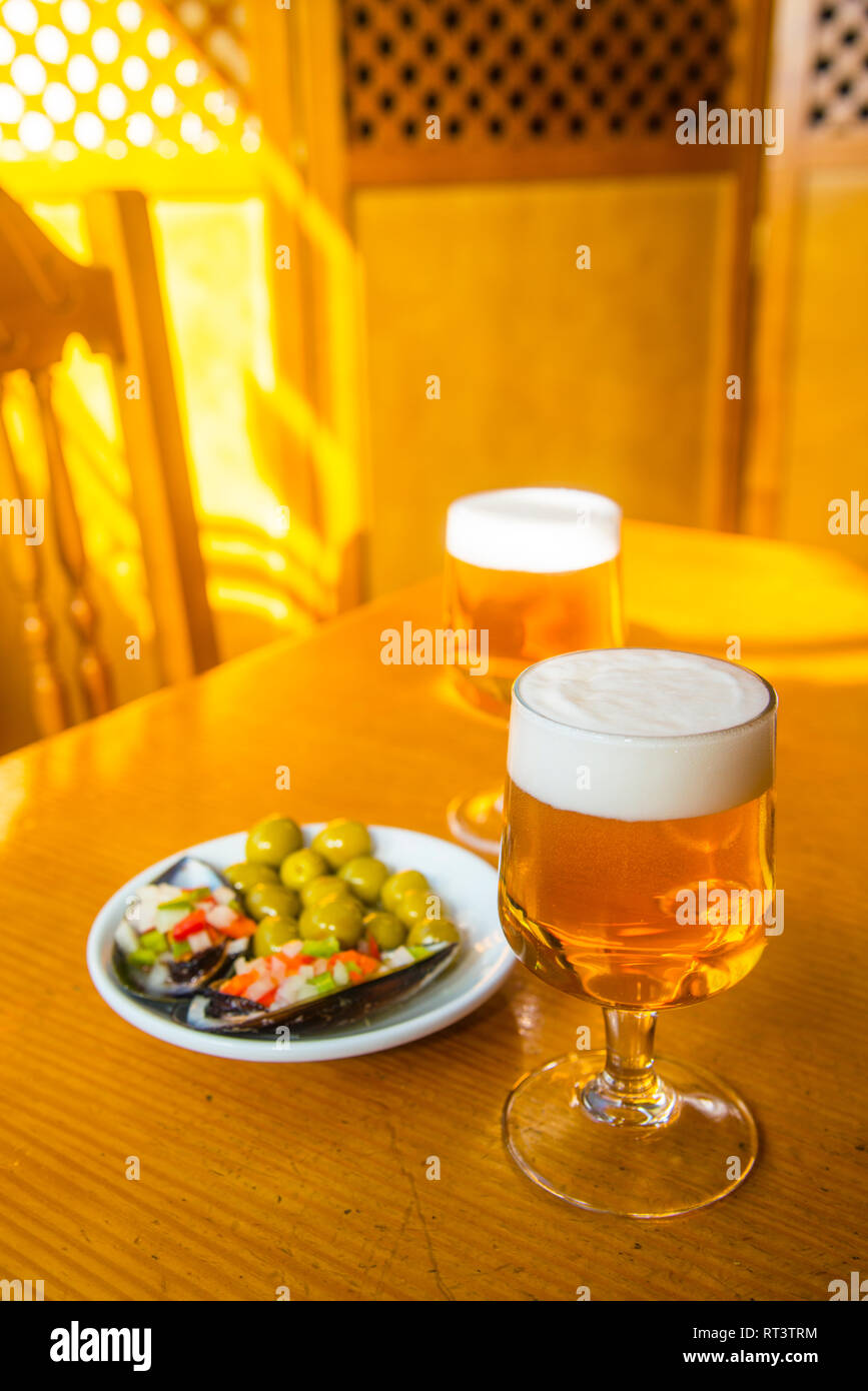 Two glasses of beer with tapa. Spain. Stock Photo