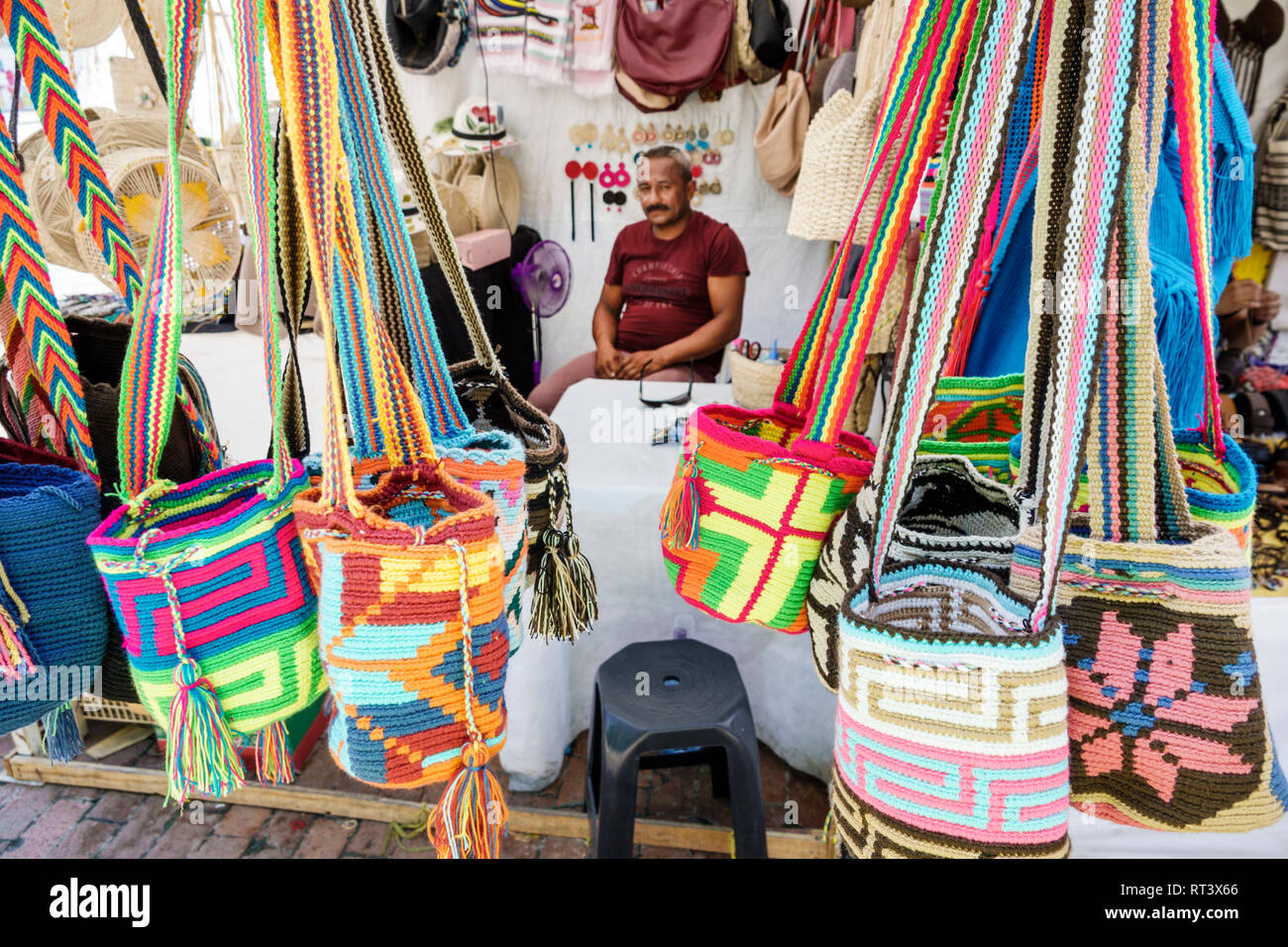 Cartagena Colombia,shopping shoppers shop shops market buying selling,store stores business businesses,display sale,handbags,Hispanic man men male,ven Stock Photo