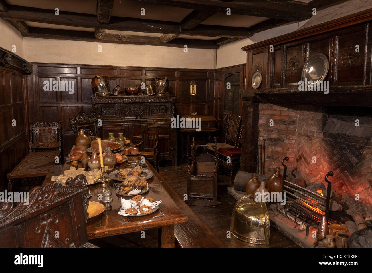 Stuart period (c.1698) dining room with fire, York Castle Museum, York, Yorkshire, UK. Stock Photo