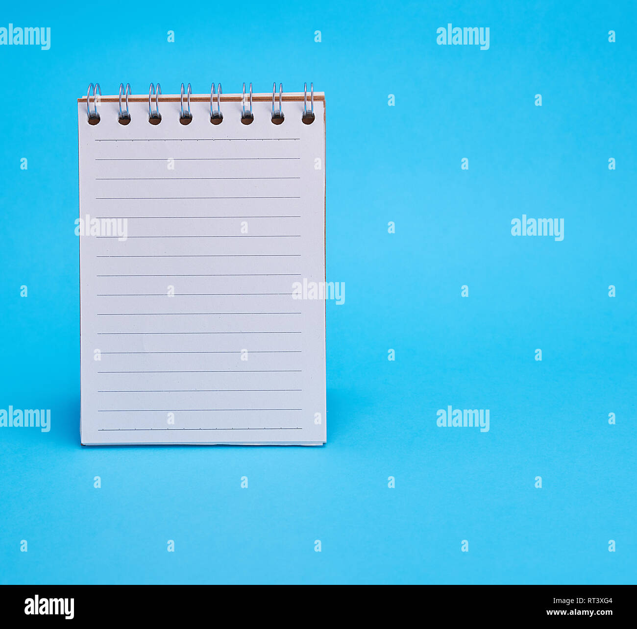 open blank notebook in line on a blue background, copy space Stock ...