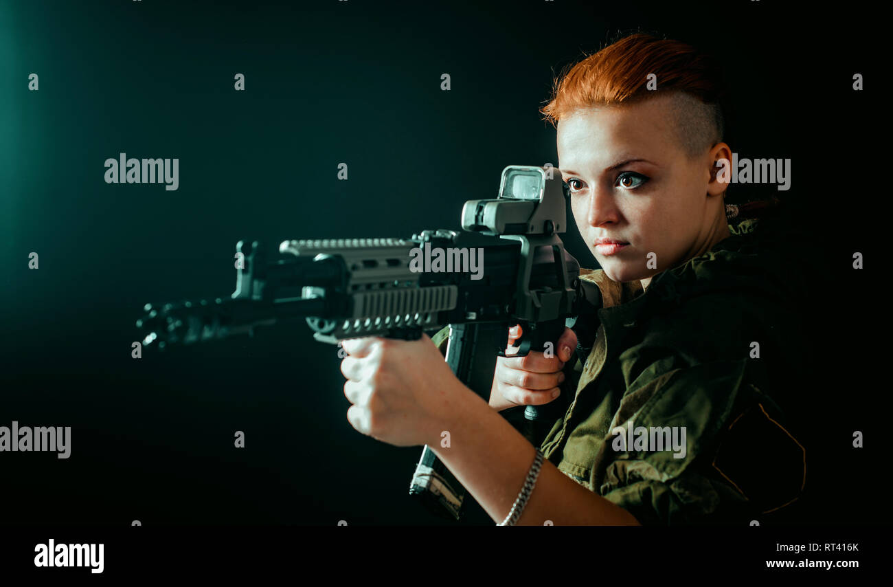 Young woman with red hair in military green uniform Stock Photo - Alamy