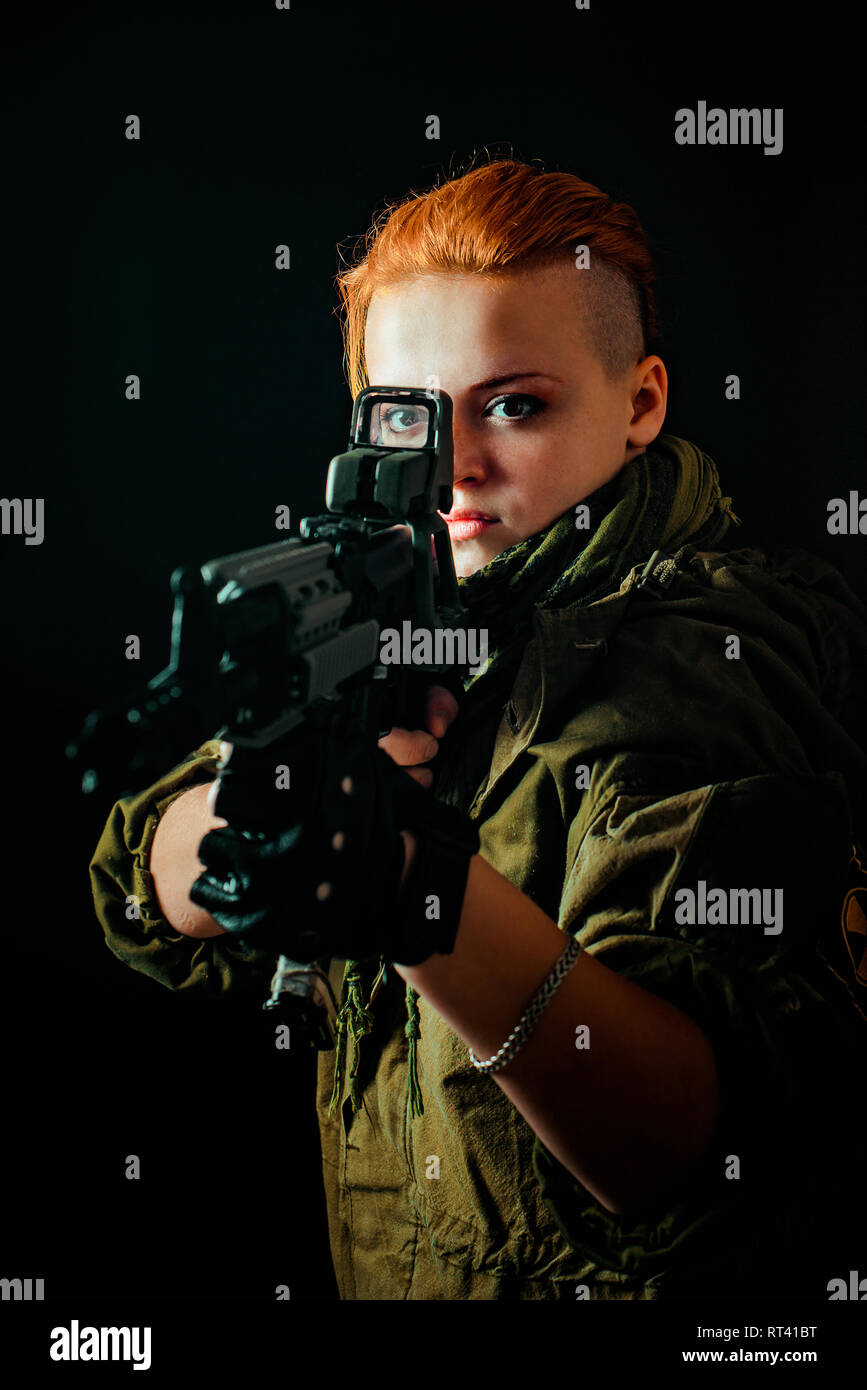 Young woman with red hair in military green uniform Stock Photo - Alamy