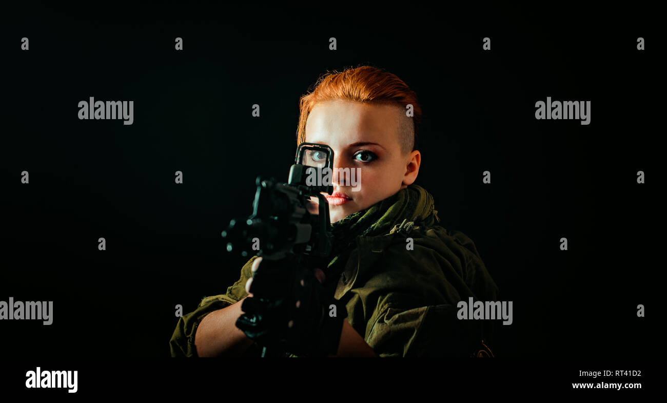 Young woman with red hair in military green uniform Stock Photo - Alamy