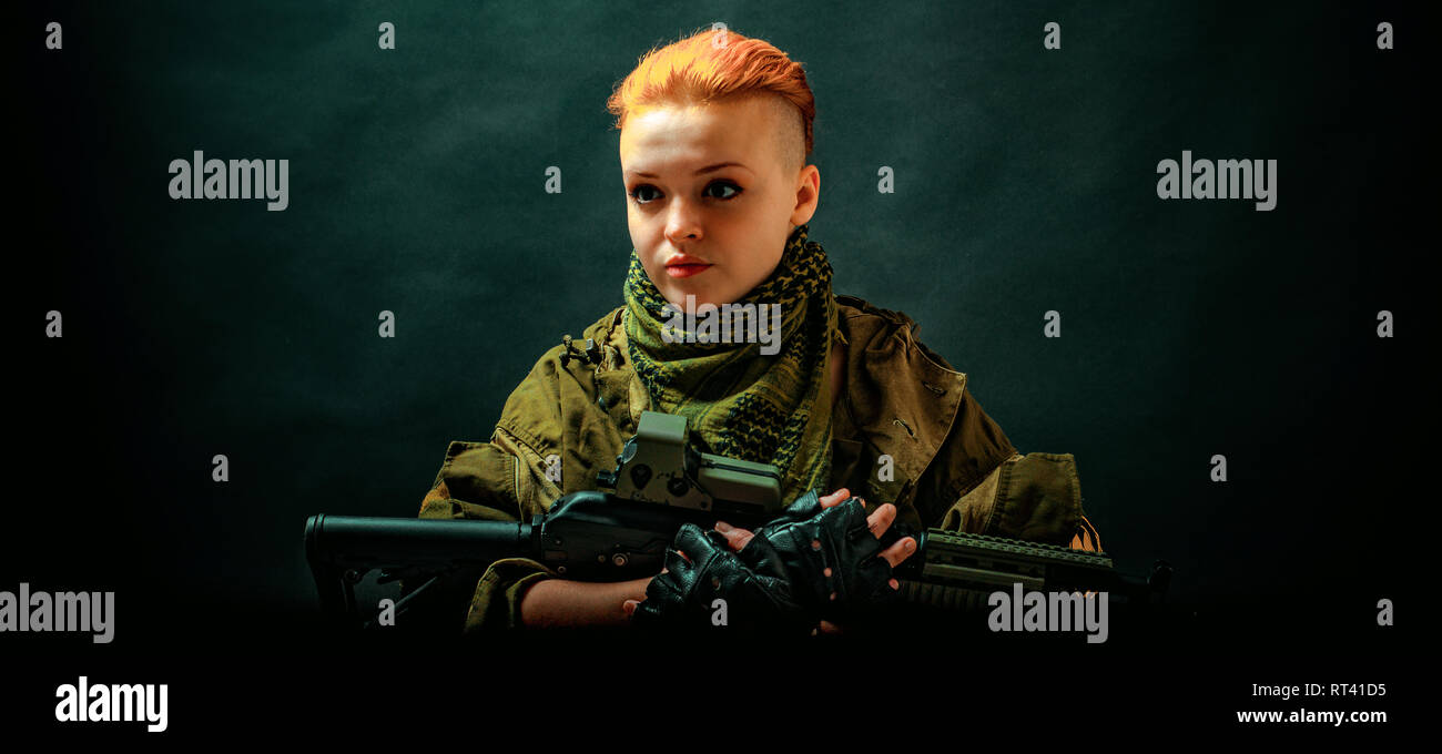 Young woman with red hair in military green uniform Stock Photo - Alamy