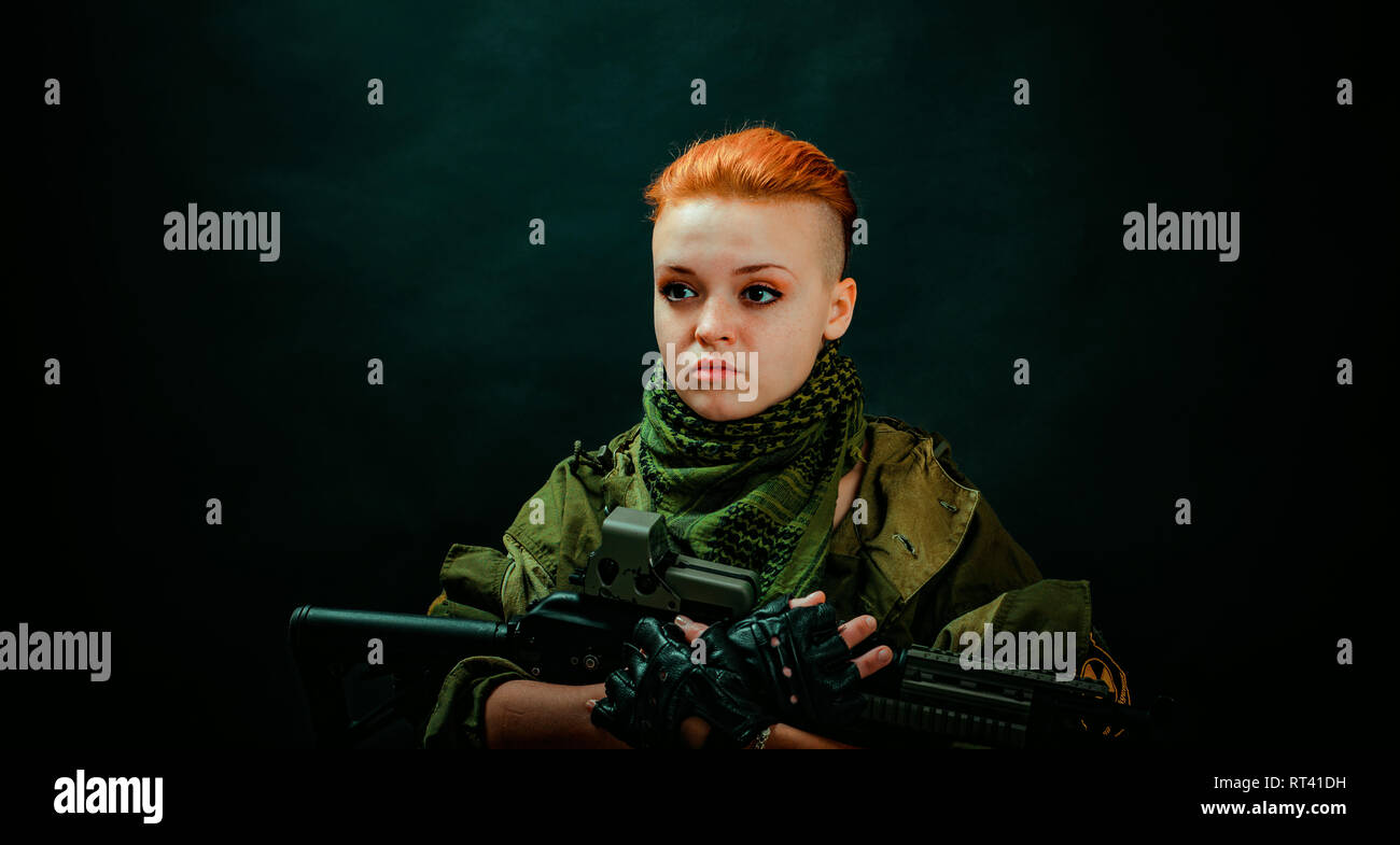 Young woman with red hair in military green uniform Stock Photo - Alamy