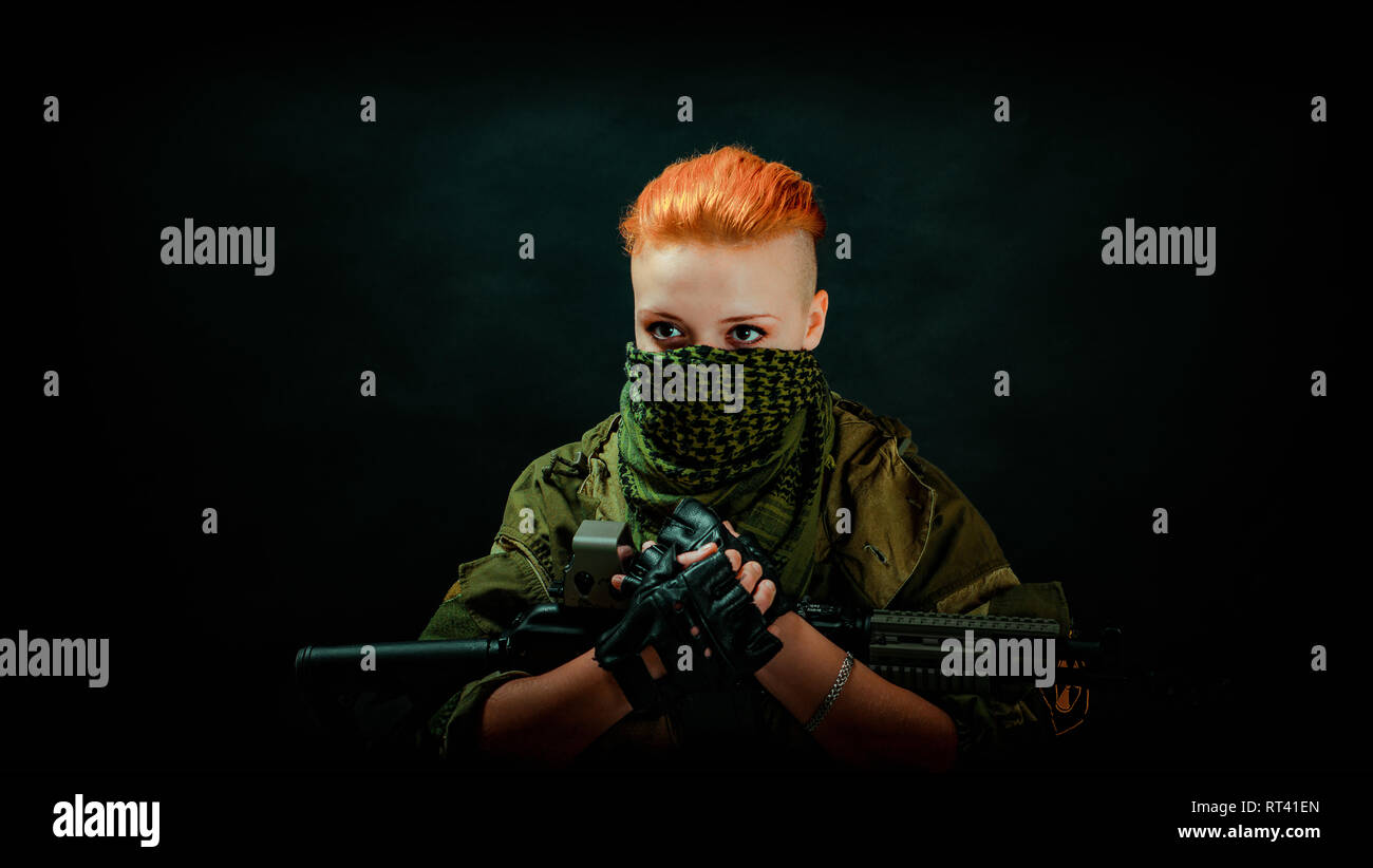 Young woman with red hair in military green uniform Stock Photo - Alamy