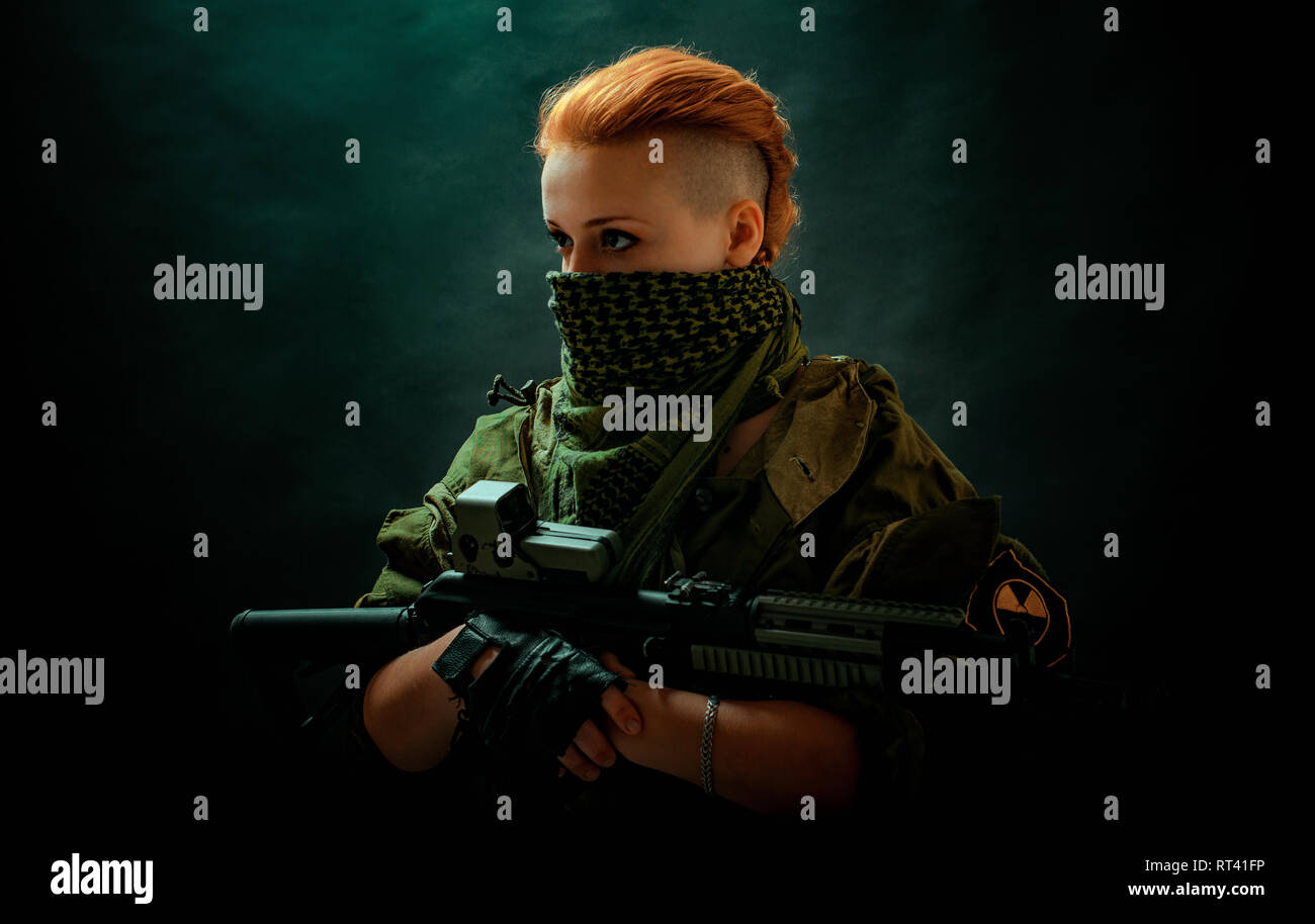 Young woman with red hair in military green uniform Stock Photo - Alamy