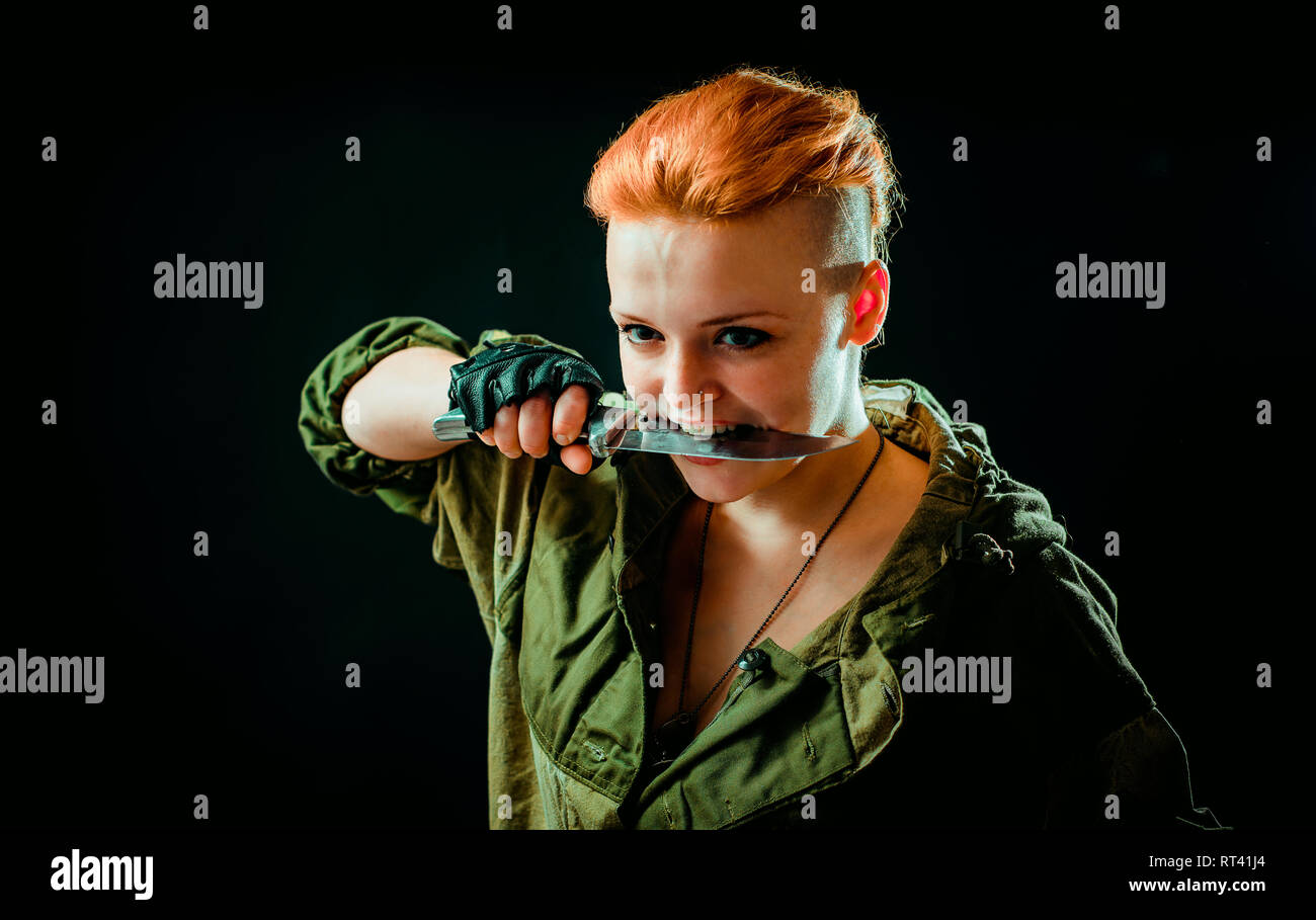 Young woman with red hair in military green uniform Stock Photo - Alamy