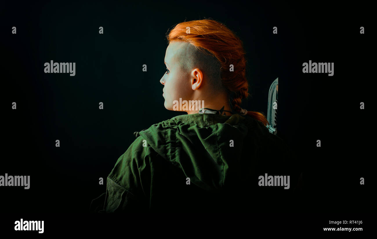 Young woman with red hair in military green uniform Stock Photo - Alamy