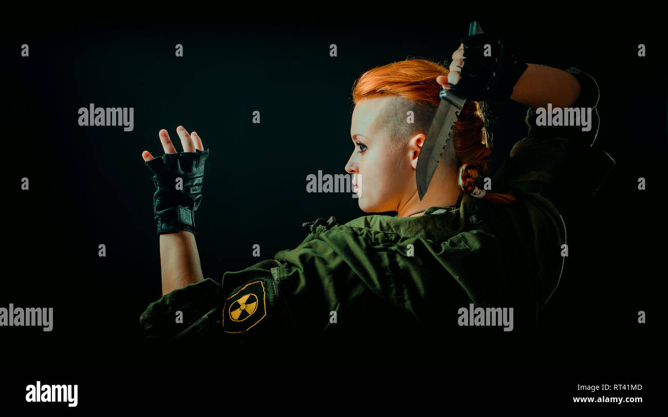 Young woman with red hair in military green uniform Stock Photo - Alamy