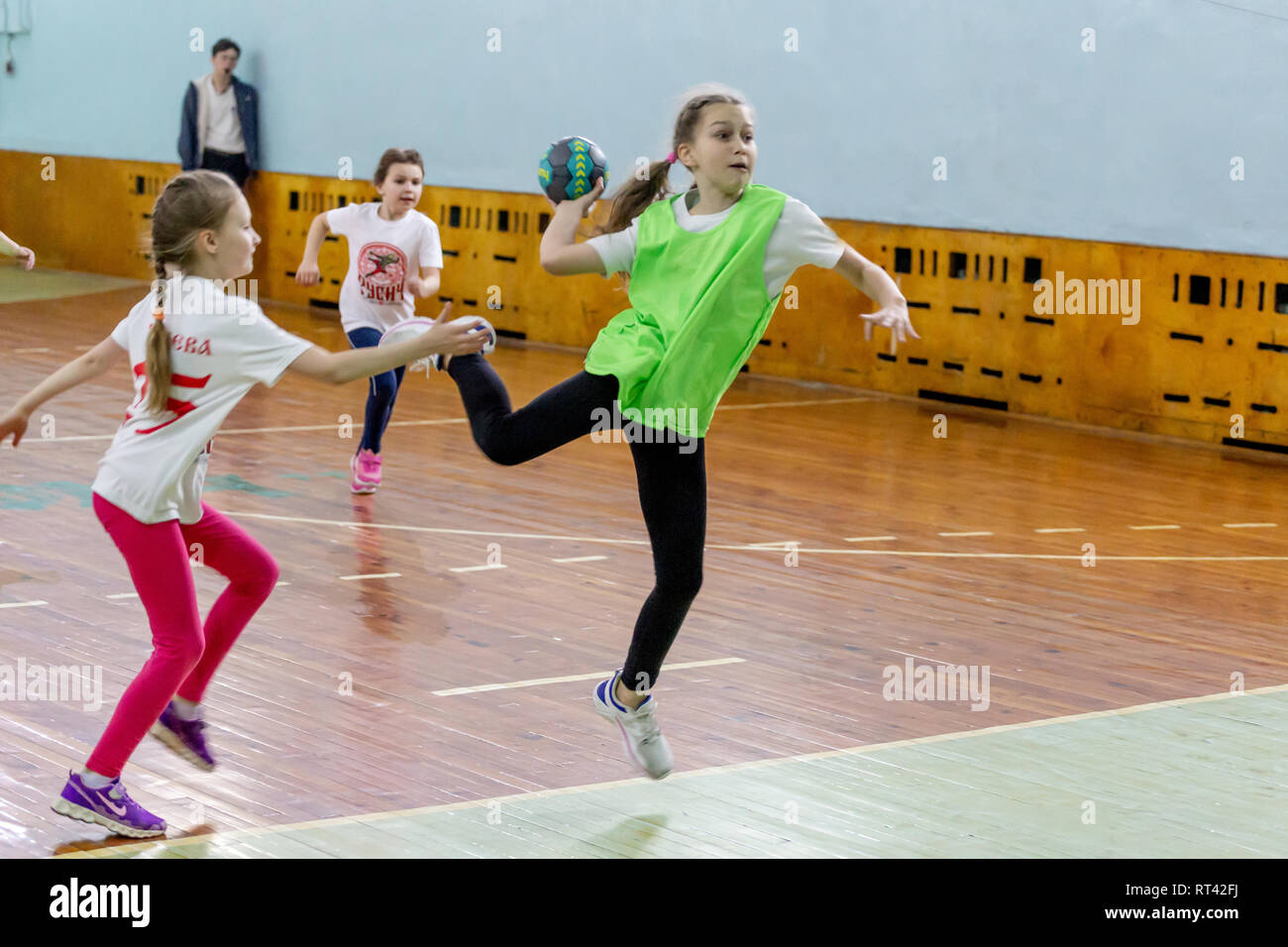 Russia, Vladivostok, 02/26/2019. Kids play handball indoor. Sports and