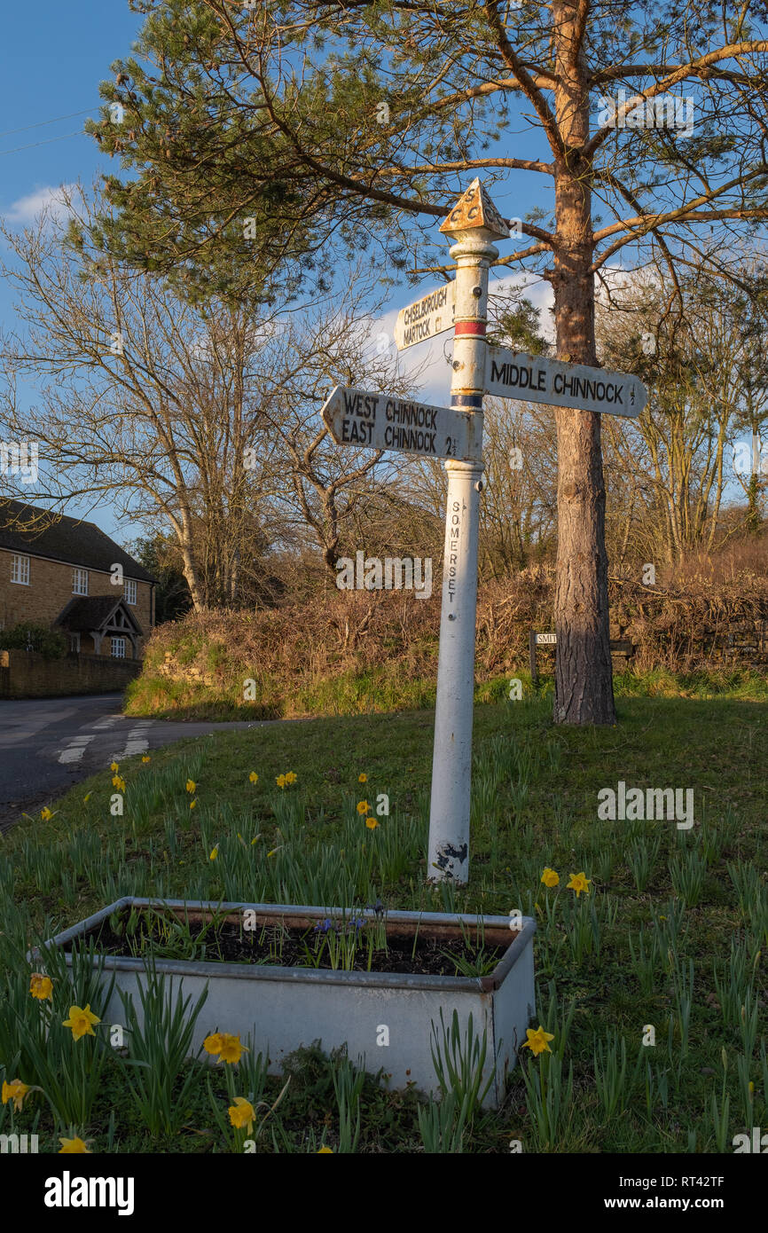 An old vintage black and white village direction signpost in West