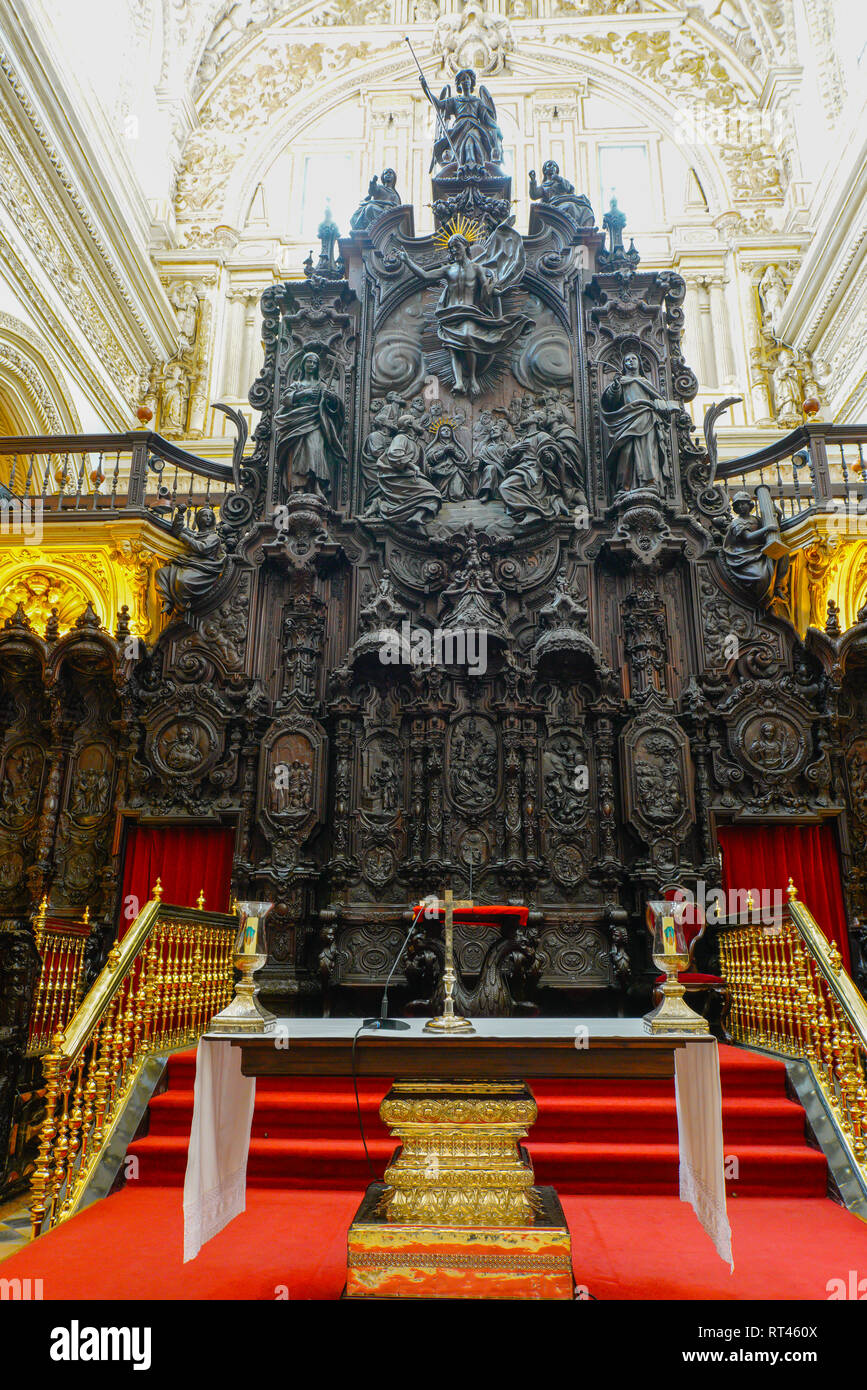 Christian altar with biblical scenes carved in mahogany, Cathedral of Córdoba, Spain. Stock Photo