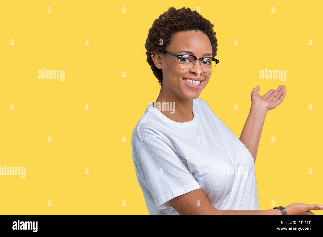 Beautiful young african american woman wearing glasses over isolated ...