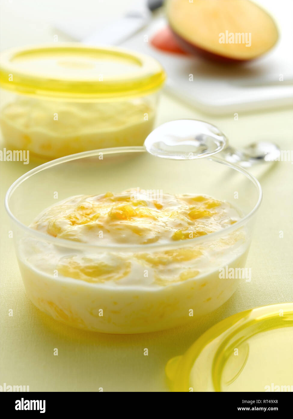 babies mango and yogurt Stock Photo