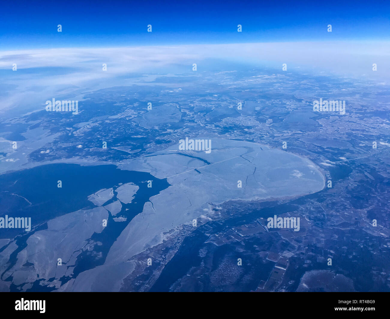 An aerial view of a bay by Pärnu in Estonia from the airplane flying high above the ground. A look from the plane´s window. Stock Photo