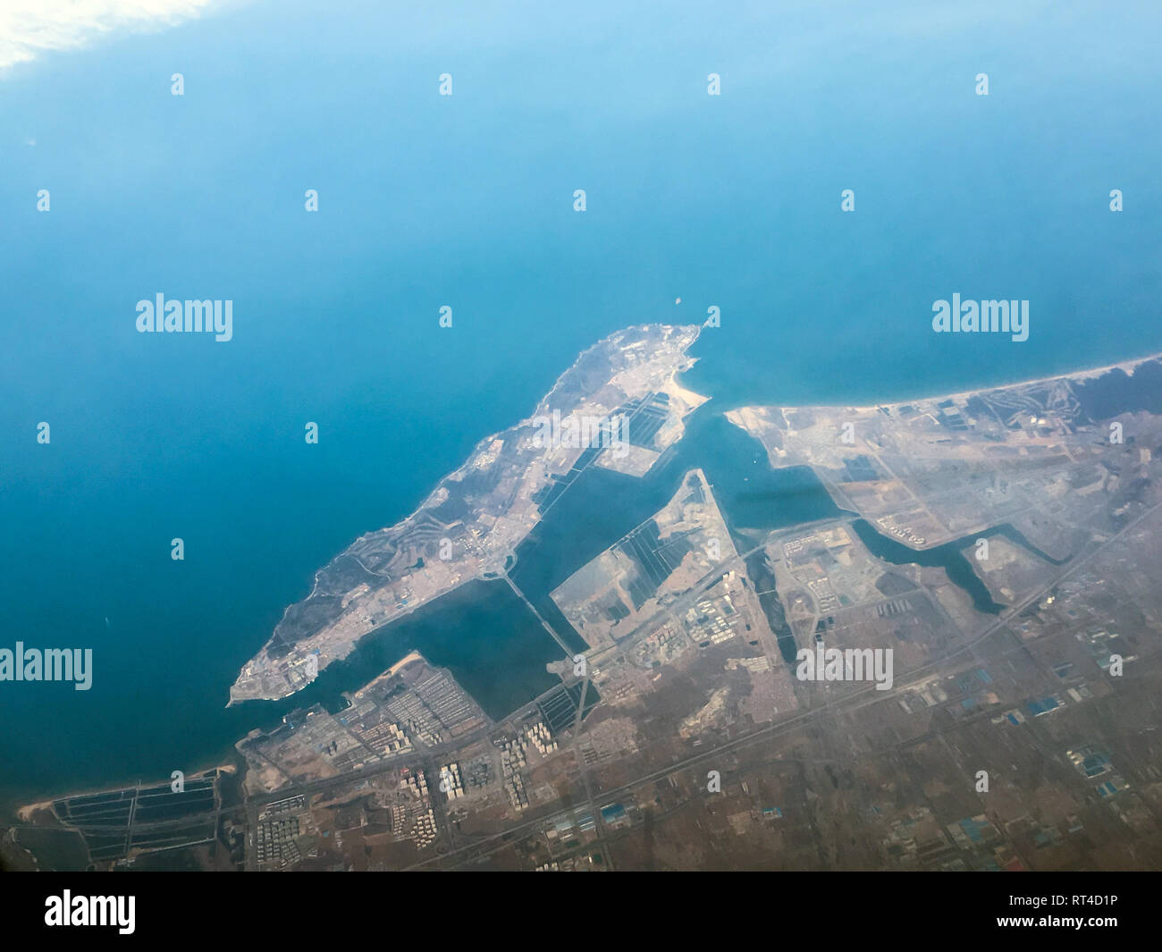 An aerial view of the Yangma island in China from the airplane flying high above the ground. A look from the plane´s window. Stock Photo
