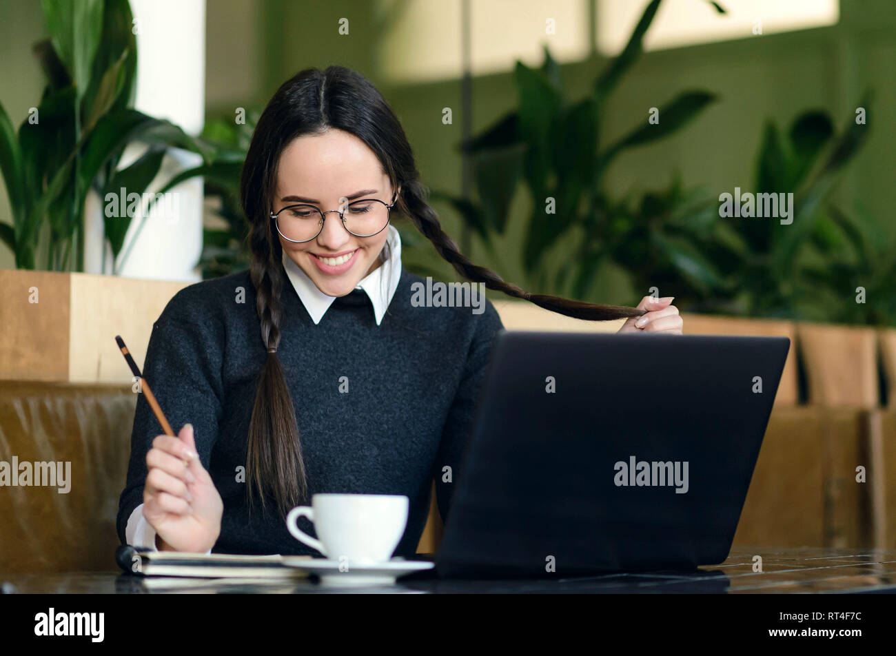 Woman wearing glasses braids hi-res stock photography and images - Alamy