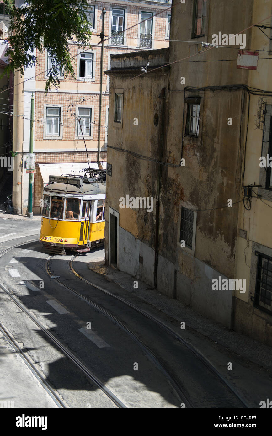 Tram 28 the famous and vintage old yellow tram 28 passing on street