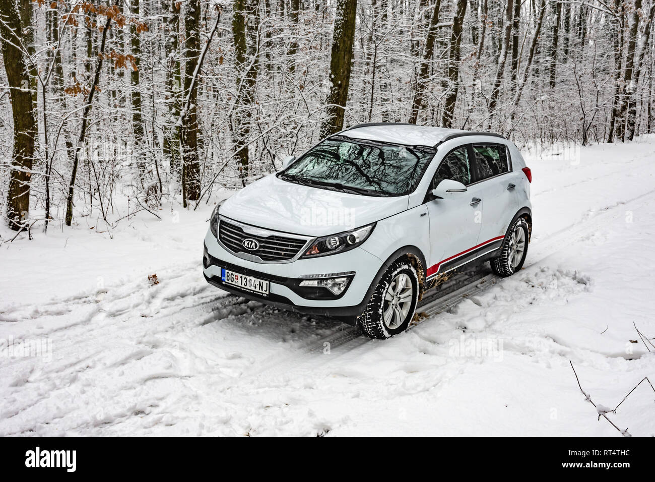 Kia Sportage 2 0 Crdi Awd Or 4x4 White Color In A Forest Road Covered With Deep Snow And Ice Extreme Conditions And Temperatures Below 10 Stock Photo Alamy