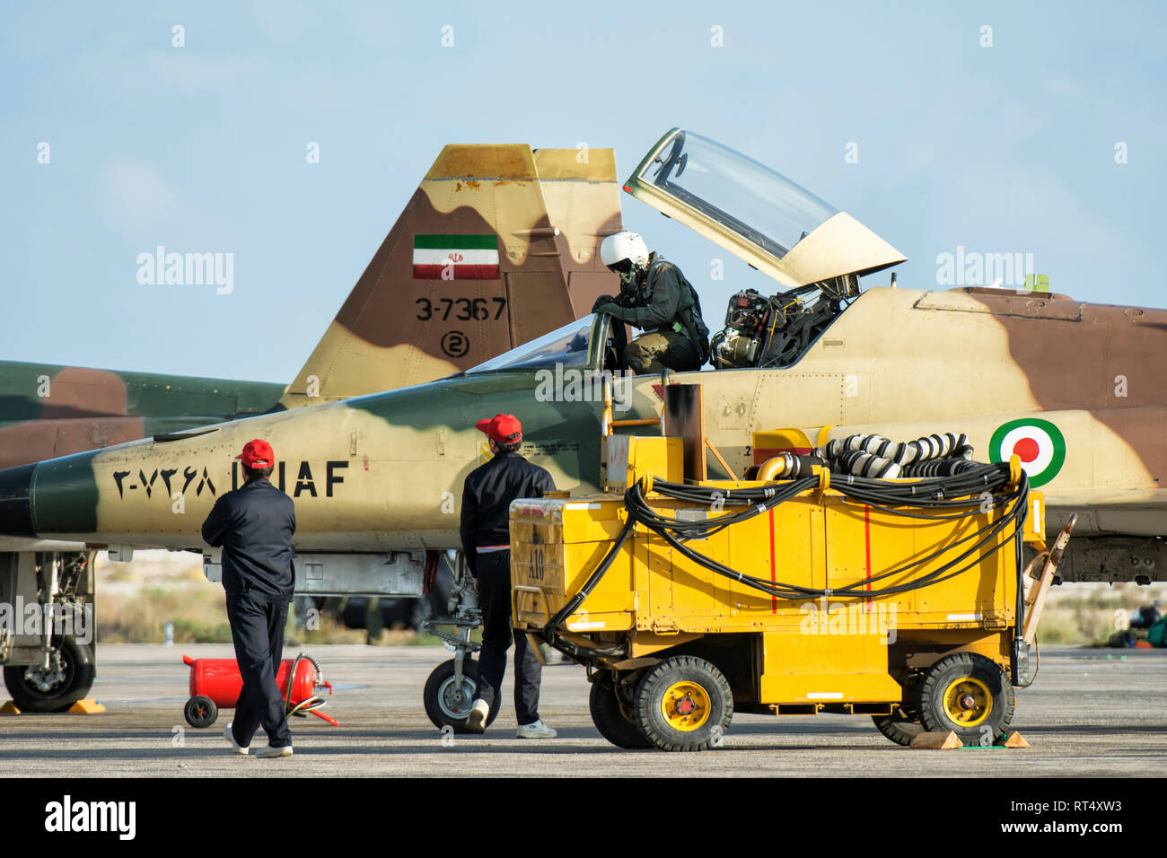The pilot of a HESA F-5E Saegheh I leaves its aircraft. Stock Photo