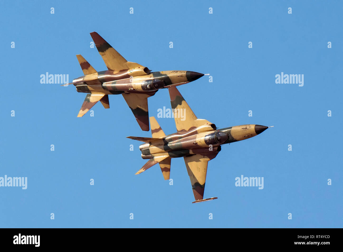 A pair of Islamic Republic of Iran Air Force HESA Saegheh I aircraft in flight. Stock Photo