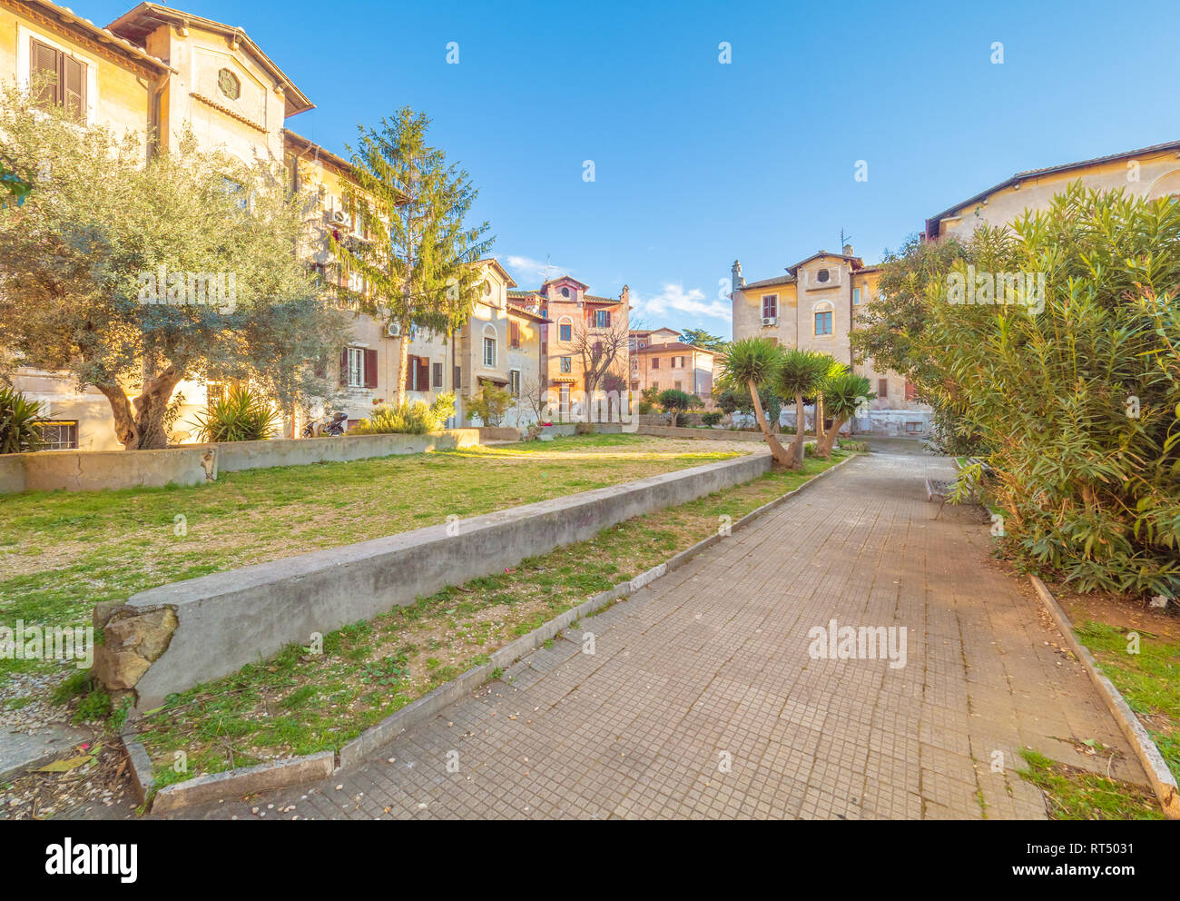 Rome (Italy) - The suggestive popular Garbatella quarter in Ostiense district, an agglomeration in Rococo style with gardens and the famous modern bri Stock Photo