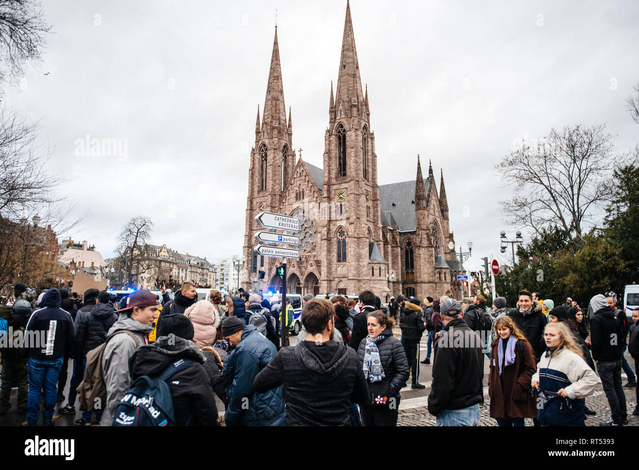 STRASBOURG, FRANCE - DEC 8, 2018: Crowd gathering in Central Strasbourg at the nationawide protest Marche Pour Le Climat in front of Reformed Church Saint Paul Stock Photo