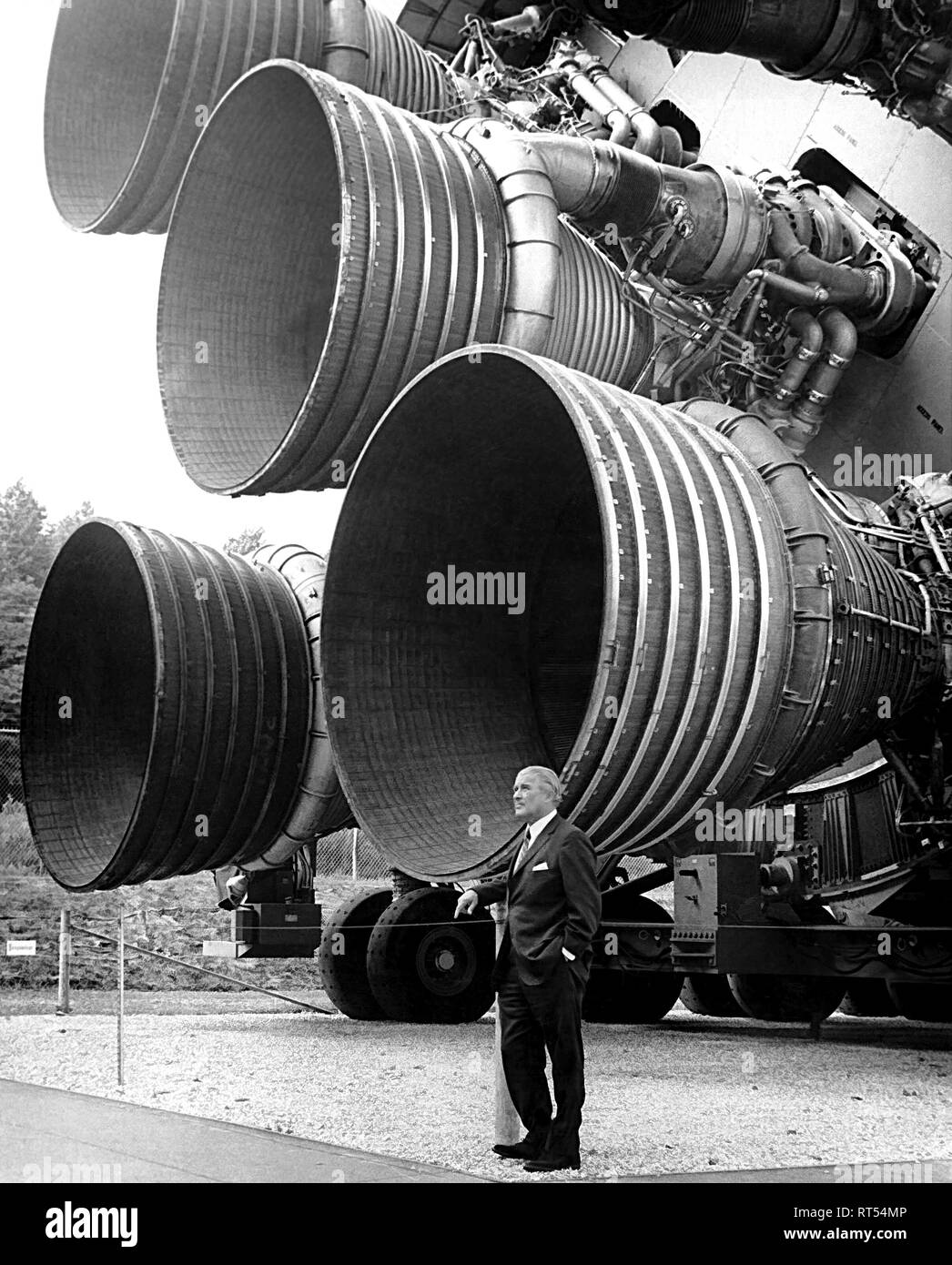 American history photograph of Wernher von Braun standing alongside the thrust of F-1 engines. Stock Photo