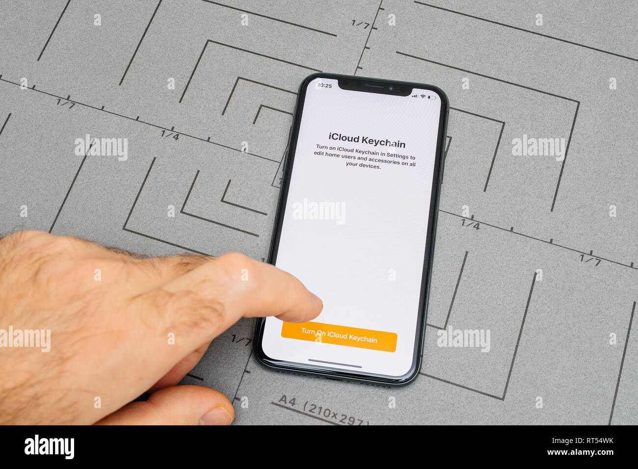 PARIS, FRANCE - NOV 9, 2017: Male hand touch selecting New Apple iPhone ...